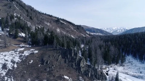Aerial low angle shot of mountain village and river Stock Footage 74064150