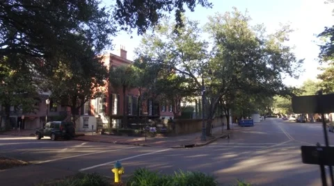 Aerial Low Angle Shot Pushing into a House across from a Town Square Park in Dow Stock Footage 57705864