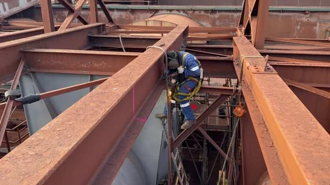 Aerial low angle shot of technician welding beams Stock Footage 334711158