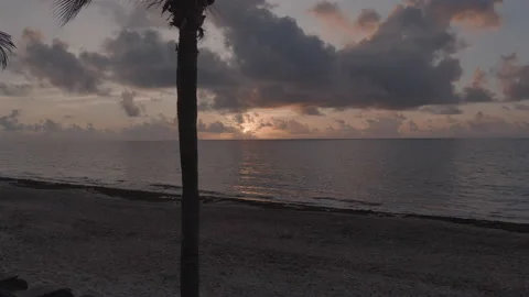 Aerial Low Angle Tracking Shot of Beach Sunrise 6K LOG.  Stock Footage 200775643