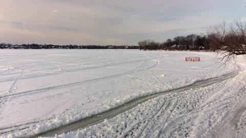 Aerial low angle view flying near the white snow on the frozen river Stock-Footage 164346158