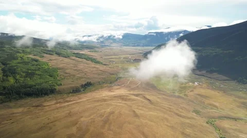Aerial of low cloud above Brush Creek mountain valley in Crested Butte Colorado Stock Footage 251125495