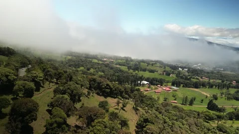 Aerial low cloud layer in tropical highland terrain near Poas Costa Rica Stock Footage 330209752