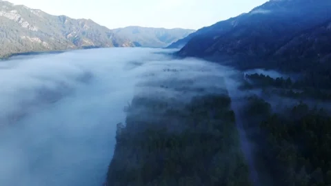 Aerial - Low Clouds on the Forest and River Stock Footage 202106947