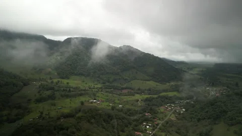 Aerial low clouds over remote highland town in Poas Volcanic region Costa Rica Stock Footage 330213670