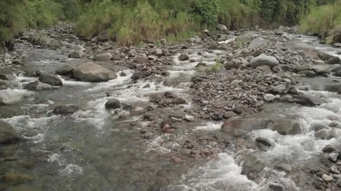 Aerial. A low drone view of a shallow riverbead. HD Stock Footage 139065403
