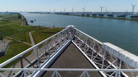 Aerial low flight over on of the arms of Maeslantkering storm surge barrier 4k Stock Footage 76882161