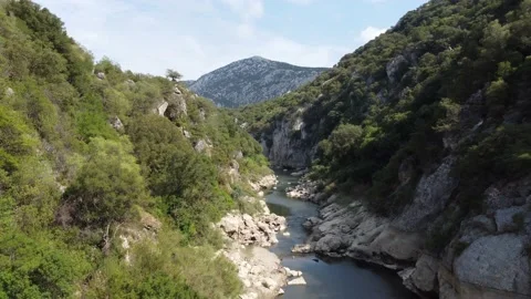 Aerial-Low Flight Over Clear Mountain Stream-Pull Back-4K Video stock 225857063