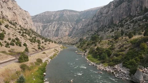 Aerial low flight over rushing water in Wind River Canyon Stock Footage 335009903