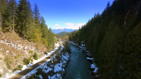 Aerial Low Flight Through Mountain River Rocky Alpine Mountains Vivid Canada Stock Footage 120086962