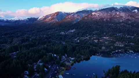 Aerial low light dolly in over Puerto Manzano forest at sunset with Andes Stock Footage 334137755