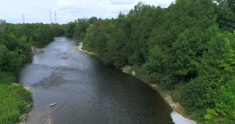 Aerial Low Over River Approaching Tubers Floating Down The Flowing Waters Stock Footage 186452580