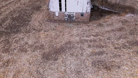 Aerial low pass over barn on county X Stock Footage 297278360