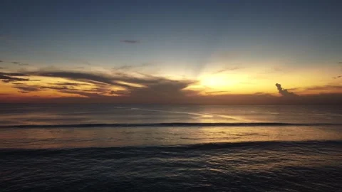 Aerial low sunset hover over Dreamland Beach, Bali 스톡 동영상 329005418