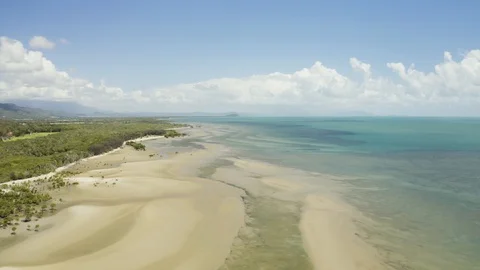 Aerial, low tide and huge sand ocean bed and mangroves growing in Queensland  Stockbeeldmateriaal 104035409