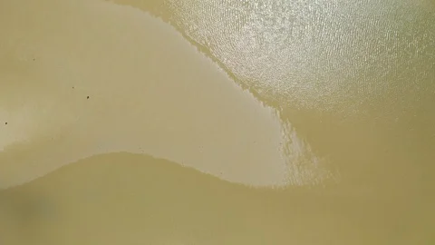 Aerial, low tide and huge sand and empty ocean bed, top down view in Queensla Vídeo Stock 113666488