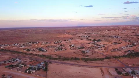 Aerial lowering to the opal mining town of Coober Pedy, Austrailia Stock Footage 108757787