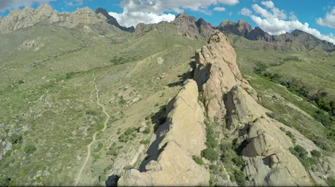 Aerial Lowering on Small Mountain Range Stock Footage 63434756