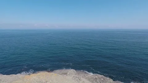 Aerial man alone on the cliffs Stock Footage 194972171