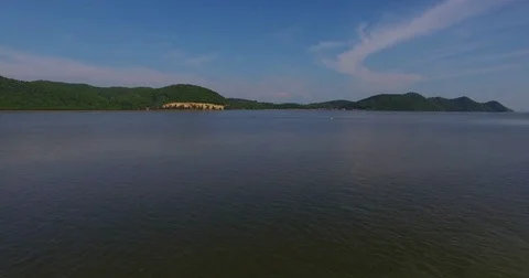 Aerial: Man controls the drone from the pier. Stock Footage 72283748