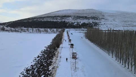 Aerial man running winter Stock Footage 263286467