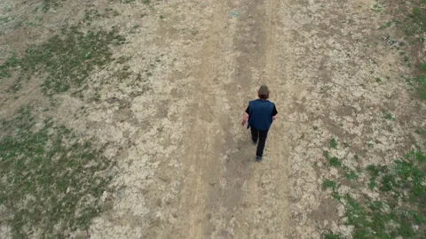 Aerial man walking Stock Footage 203041030