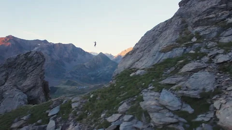 Aerial of man walking on slackline Stock-Footage 64723744