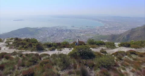 Aerial of Man Walking on Top of Table Mountain, Cape Town Stock Footage 60115055
