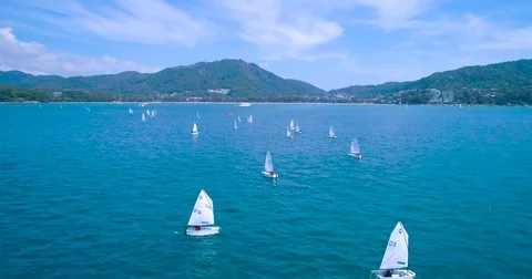 Aerial: Many small sailboat float in the sea. Regatta. Stock Footage 83405264