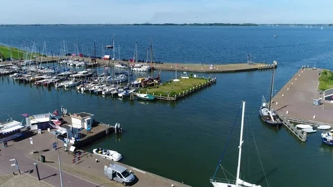 Aerial of Marken harbor panning camera to right showing recreational boats 4k Stock Footage 85574616