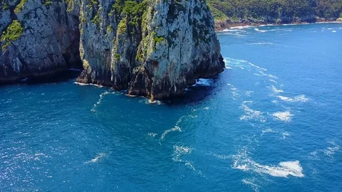 Aerial: Massive rocks in ocean. New Zealand Video stock 90799448