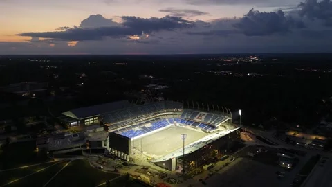 Aerial of Memorial Stadium Under Dramatic Storm Clouds Video stock 337970267