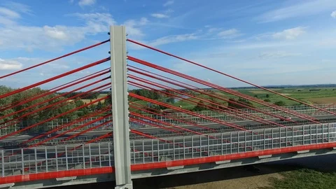 Aerial of Modern Highway Cable-Stayed Bridge on River Stock Footage 86250349