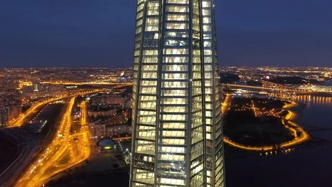 Aerial modern skyscraper triangular top Petersburg night illumination cityscape Stock Footage 128621159