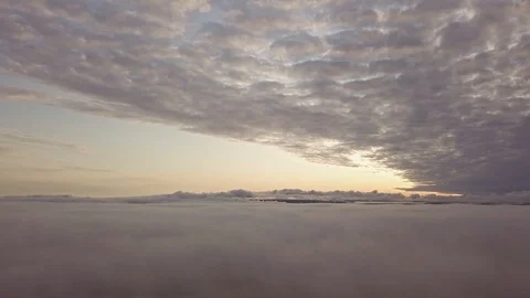 Aerial mornig view between layers of fog and clouds Stock Footage 122032318