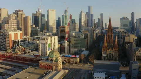 Aerial morning empty Flinders Street Station entrance Melbourne Covid lockdown Stock Footage 139108355