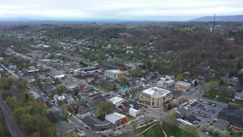 Aerial motion to the right turning to left of Berkeley Springs, WV. Video stock 106419008