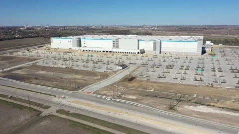 Aerial motion view Amazon Fulfillment Center under construction, Pflugerville TX Stock Footage 148449280