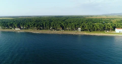Aerial: motion view approaching beach from the sea side Stock-Footage 114426733