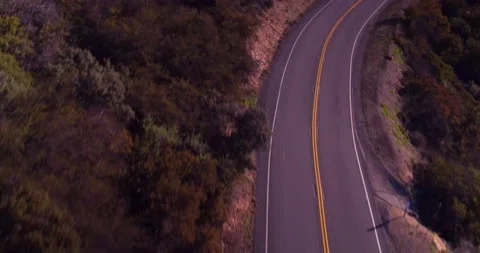 Aerial motion view of empty winding road Stock Footage 136341176