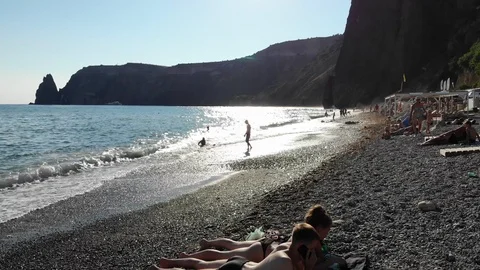 Aerial motion waves roll foaming on pebble beach at sea Video stock 103181859