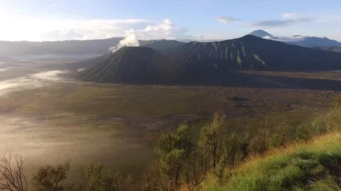 Aerial of Mount Bromo volcano during sunrise Stock Footage