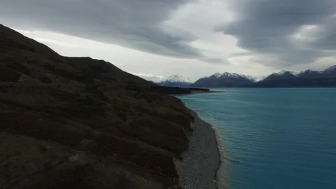 Aerial Of Mount Cook Pulling Back Over Turquoise Water Glacier Lake Cloudy Day Stock Footage 102151056