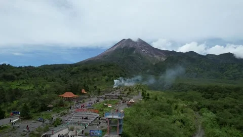 Aerial Mount Merapi Volcano Surrounded by Misty Forest Stock Footage 321649099