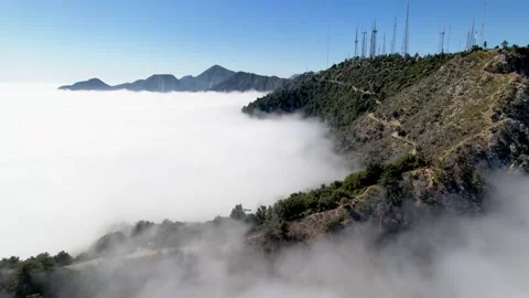 Aerial of Mount Wilson above the clouds Stock Footage 153052151