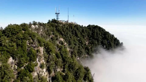 Aerial of Mount Wilson above the clouds Stock Footage 153052175