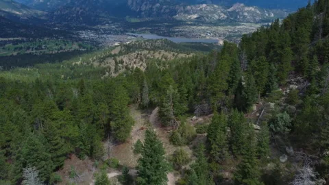 Aerial of mountain bikers traversing a high mountain trail in Colorado Stock Footage 247363767