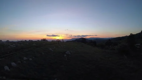 Aerial: Mountain biking at sunset Stock Footage 76047485