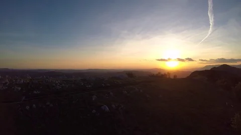 AERIAL Mountain biking at sunset Stock Footage 76112815