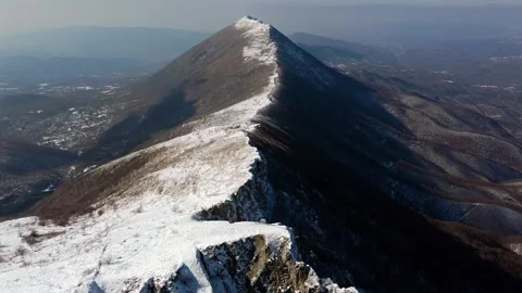 Aerial Mountain Cliff in Winter Video stock 317050327